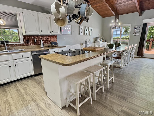 360 David Dr, Washington, MO 63090 - kitchen featuring dishwasher, light wood-type flooring, black electric stovetop, a chandelier, and wooden ceiling