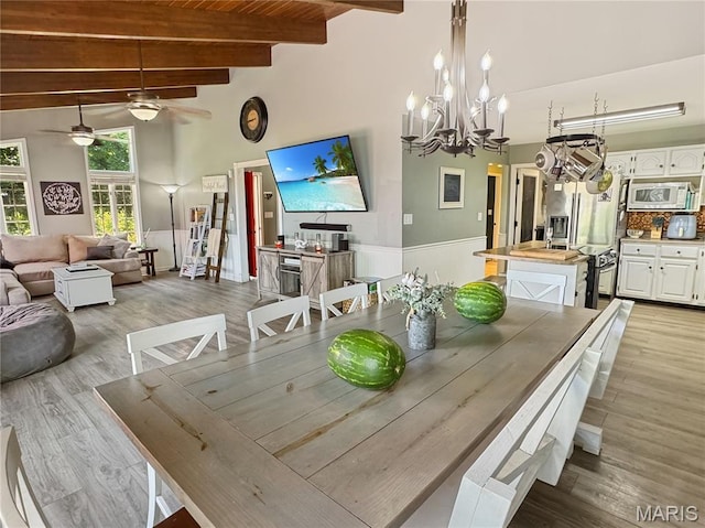 360 David Dr, Washington, MO 63090 - dining room featuring a ceiling fan, high vaulted ceiling, beam ceiling, light wood-style floors, and a chandelier