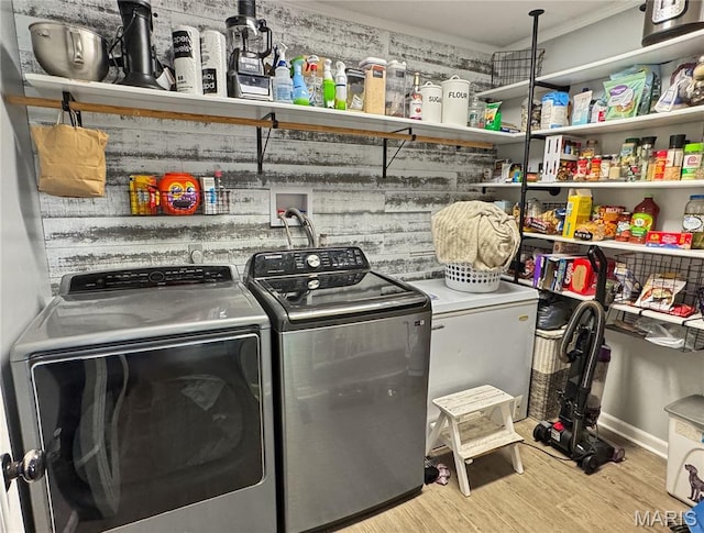 360 David Dr, Washington, MO 63090 - laundry area featuring washing machine and clothes dryer and light wood-style flooring