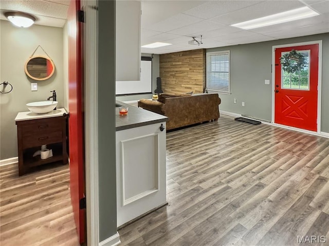 360 David Dr, Washington, MO 63090 - kitchen with a drop ceiling, wood finished floors, and dark countertops