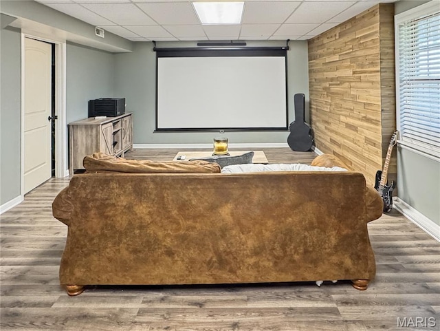 360 David Dr, Washington, MO 63090 - home theater room featuring a drop ceiling, wood finished floors, and wooden walls