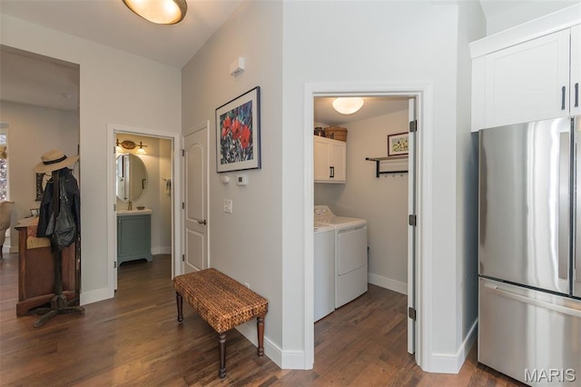 2514 S Larksong Dr, Grover, MO 63040 - corridor with washer and clothes dryer and dark wood-type flooring