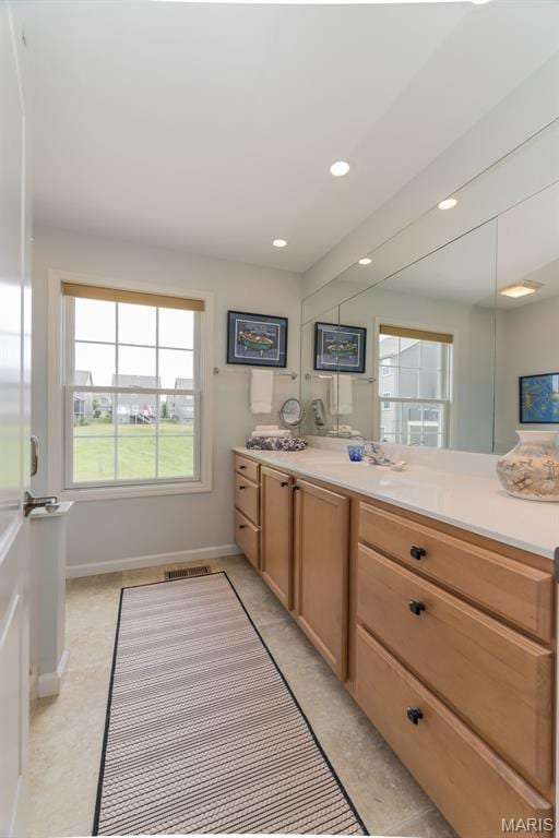 2514 S Larksong Dr, Grover, MO 63040 - bathroom with vanity, healthy amount of natural light, and recessed lighting