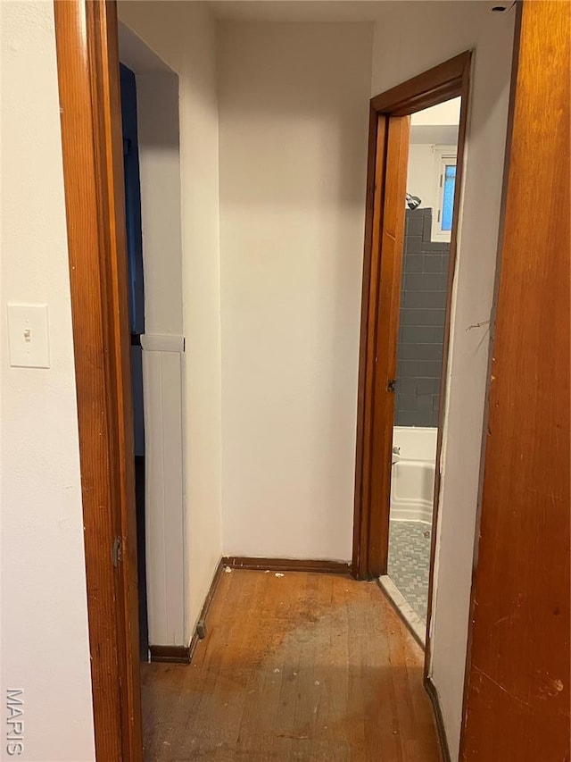 2010-12 E Desoto Ave, Saint Louis, MO 63107 - hall with wood finished floors and baseboards