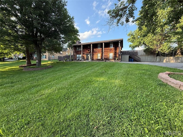 10755 Kennerly Rd, Sunset Hills, MO 63128 - back of property featuring a yard