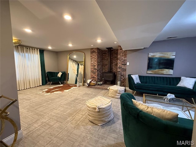 10755 Kennerly Rd, Sunset Hills, MO 63128 - carpeted living room featuring a wood stove and recessed lighting
