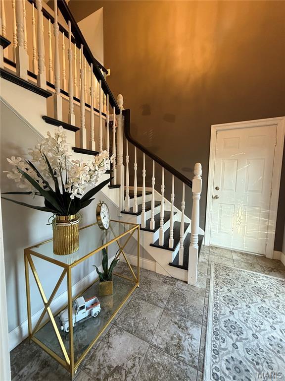 10755 Kennerly Rd, Sunset Hills, MO 63128 - staircase featuring baseboards