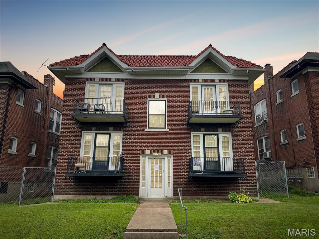 4956 Mardel Ave, Saint Louis, MO 63109 - view of front of property featuring a balcony and brick siding