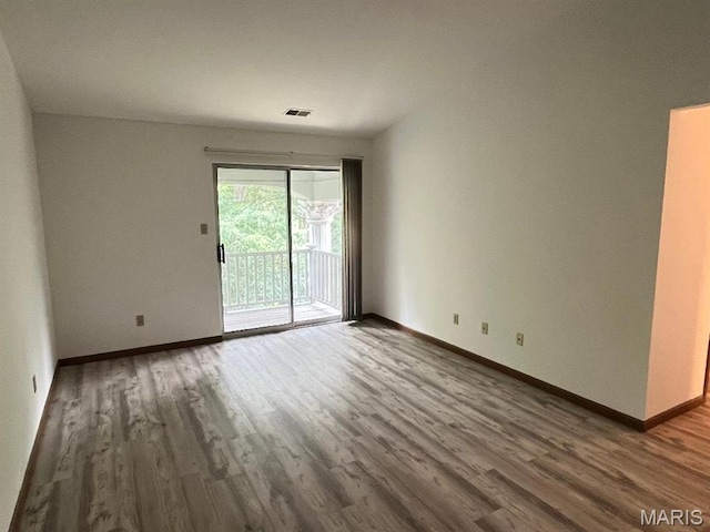 7519 Triwoods Dr Unit J, Shrewsbury, MO 63119 - empty room featuring wood finished floors and baseboards