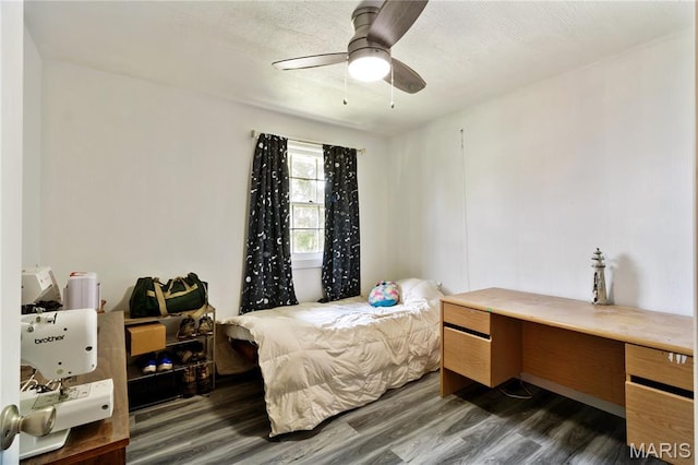 407 N 11th St, De Soto, MO 63020 - bedroom with dark wood-style flooring and a ceiling fan