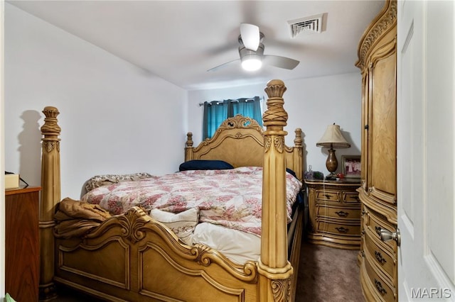 407 N 11th St, De Soto, MO 63020 - bedroom with dark colored carpet and a ceiling fan