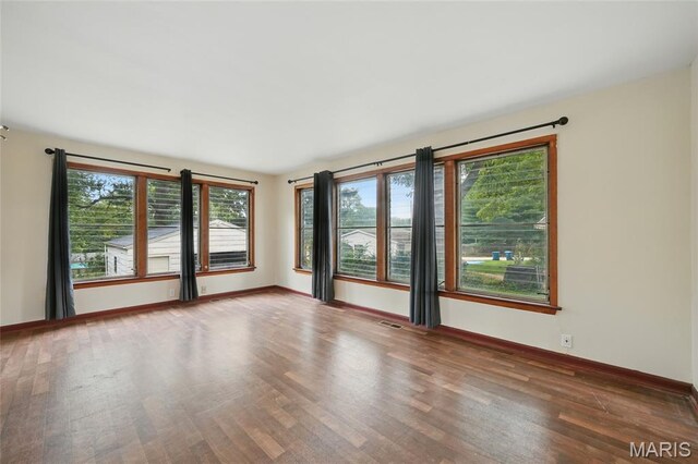 8609 Engler Ave, Saint Louis, MO 63114 - spare room with wood finished floors and baseboards