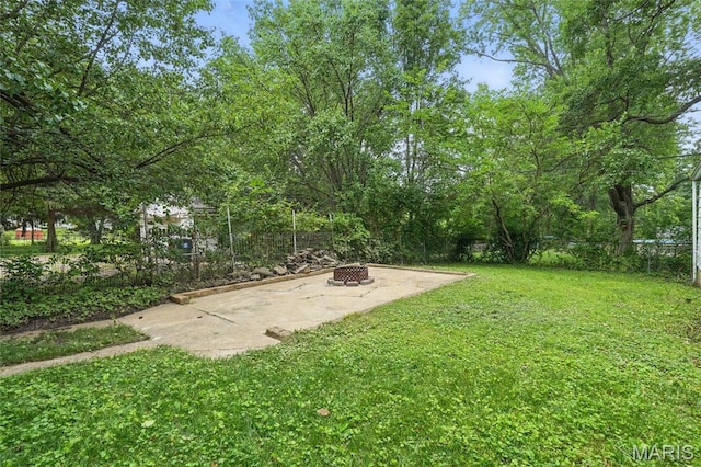 8609 Engler Ave, Saint Louis, MO 63114 - view of yard featuring an outdoor fire pit and a patio area