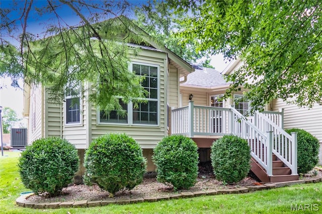 10932 Concord Circle Dr, Concord Village, MO 63123 - back of property with a wooden deck, a yard, and stairs