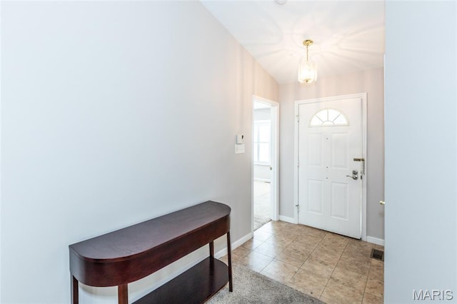 10932 Concord Circle Dr, Concord Village, MO 63123 - entryway with a chandelier and light tile patterned floors