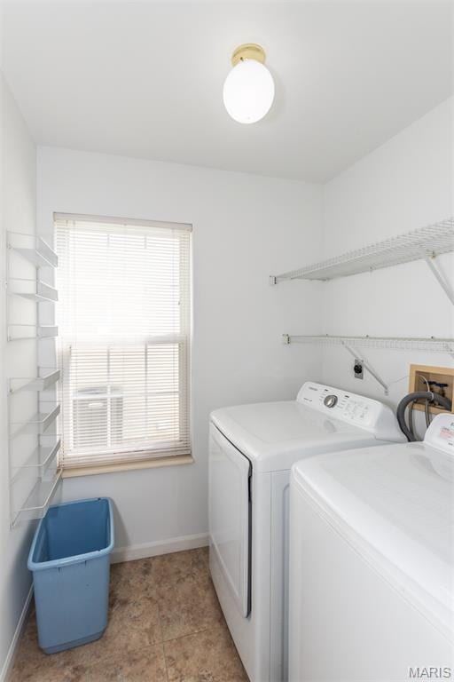 10932 Concord Circle Dr, Concord Village, MO 63123 - laundry area featuring washing machine and dryer and baseboards