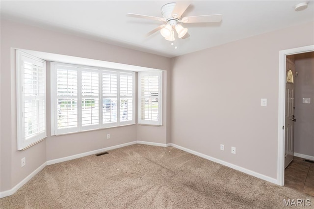 10932 Concord Circle Dr, Concord Village, MO 63123 - carpeted empty room with a smoke detector and a ceiling fan