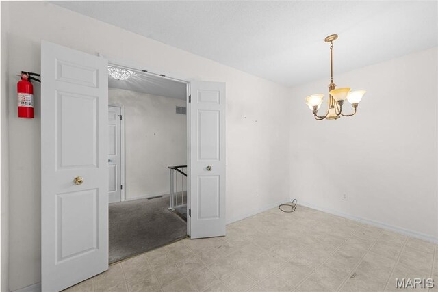 11894 Featherwood Dr, Creve Coeur Township, MO 63146 - empty room featuring a chandelier and light floors