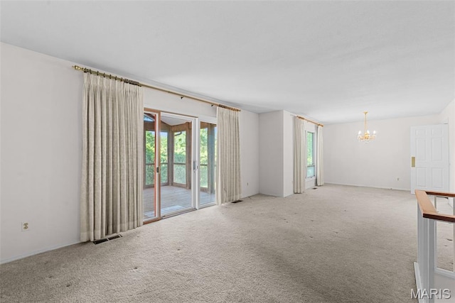 11894 Featherwood Dr, Creve Coeur Township, MO 63146 - carpeted spare room featuring a chandelier and healthy amount of natural light