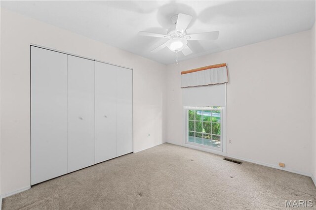 11894 Featherwood Dr, Creve Coeur Township, MO 63146 - unfurnished bedroom with carpet, a closet, and a ceiling fan