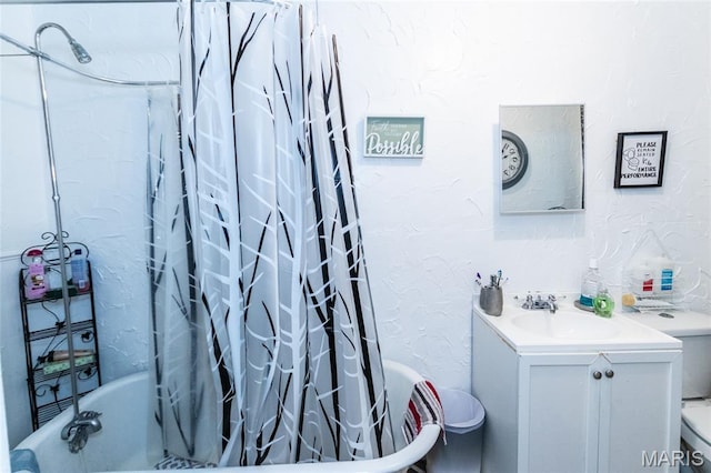 1412 Bremen Ave, Saint Louis, MO 63107 - bathroom featuring vanity, shower / bath combination with curtain, and a textured wall