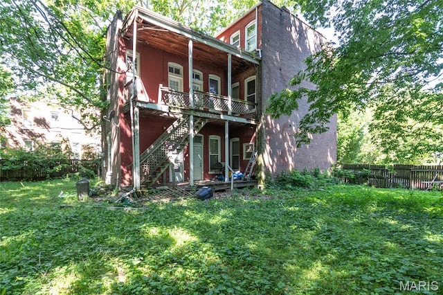1412 Bremen Ave, Saint Louis, MO 63107 - back of property featuring stairs and a wooden deck