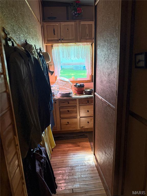 32 E 4th St, Gerald, MO 63037 - interior space with hardwood / wood-style floors and a textured wall