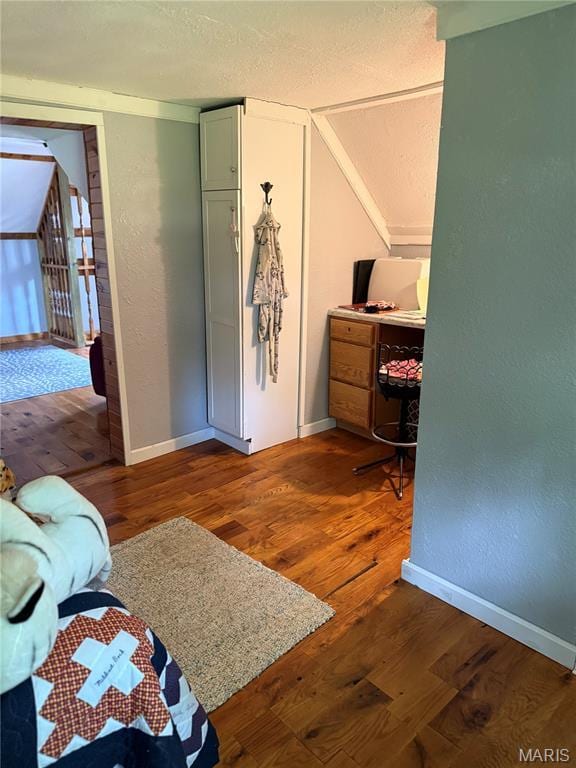 32 E 4th St, Gerald, MO 63037 - bedroom featuring wood finished floors and vaulted ceiling