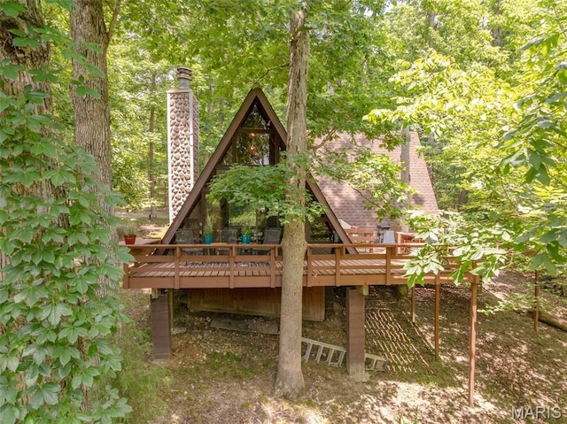 185 Hirshweg, Innsbrook, MO 63390 - back of property featuring a chimney and a deck