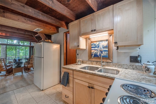185 Hirshweg, Innsbrook, MO 63390 - kitchen with freestanding refrigerator, light brown cabinets, light stone countertops, light tile patterned floors, and a wood ceiling with exposed beams