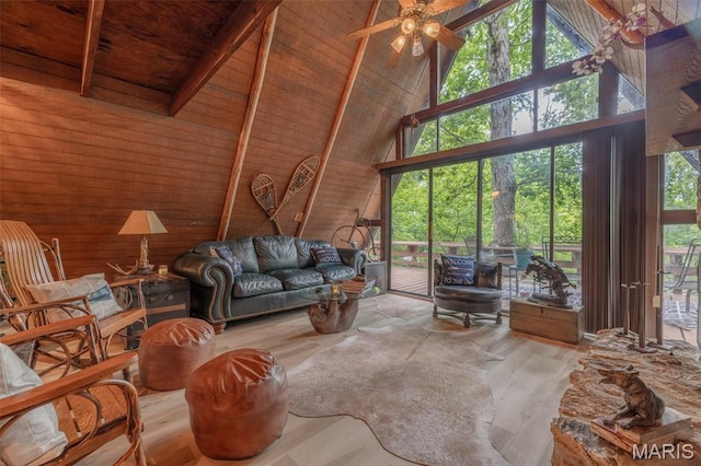 185 Hirshweg, Innsbrook, MO 63390 - living area with wooden walls, high vaulted ceiling, wood finished floors, a ceiling fan, and wood ceiling