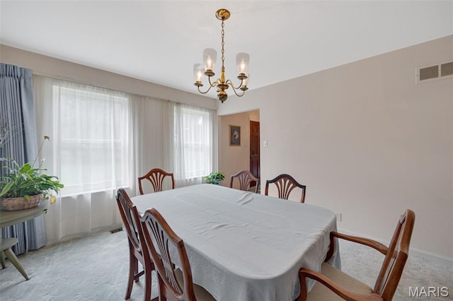 6235 Meadowlark Ln, Troy, MO 63379 - dining space featuring light carpet and a chandelier