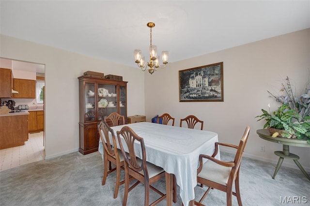 6235 Meadowlark Ln, Troy, MO 63379 - dining area featuring a chandelier and light carpet