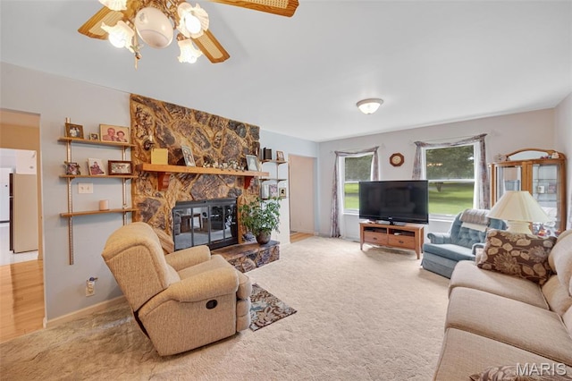6235 Meadowlark Ln, Troy, MO 63379 - living room featuring a fireplace, carpet floors, and a ceiling fan