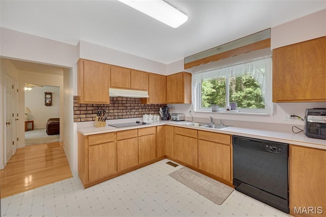 6235 Meadowlark Ln, Troy, MO 63379 - kitchen featuring black appliances, under cabinet range hood, light countertops, light flooring, and backsplash