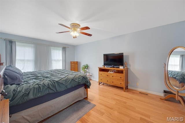 6235 Meadowlark Ln, Troy, MO 63379 - bedroom with multiple windows, light wood-style flooring, and ceiling fan