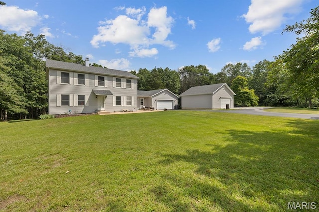 6235 Meadowlark Ln, Troy, MO 63379 - colonial house with a garage, a front yard, a chimney, and view of wooded area