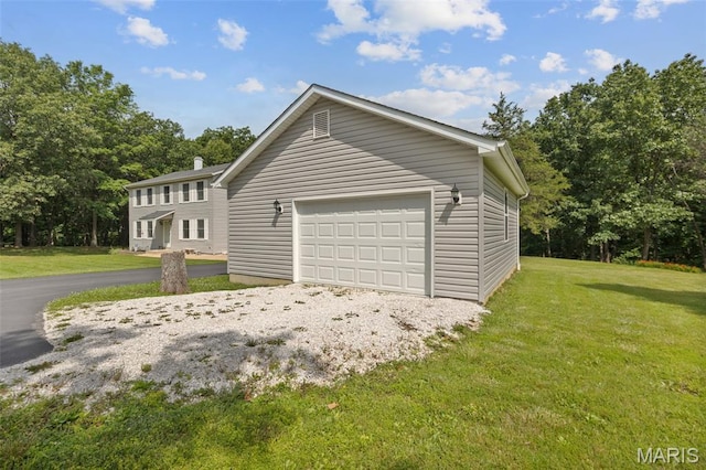 6235 Meadowlark Ln, Troy, MO 63379 - view of home's exterior with a garage and a lawn