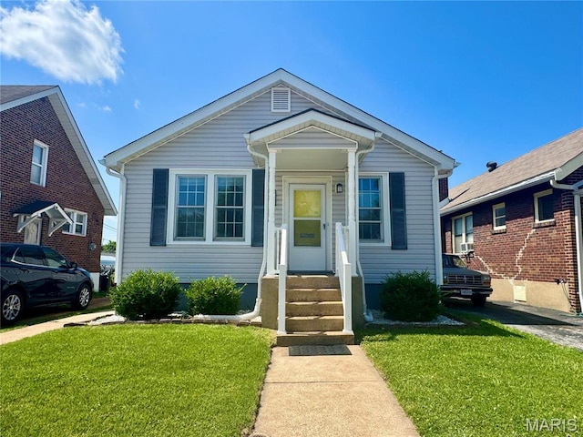 6328 Bradley Ave, Saint Louis, MO 63139 - view of front of home with a front yard and entry steps
