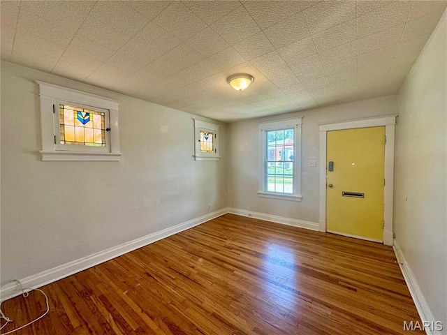 6328 Bradley Ave, Saint Louis, MO 63139 - unfurnished room featuring wood finished floors and baseboards