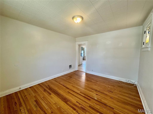 6328 Bradley Ave, Saint Louis, MO 63139 - empty room featuring wood finished floors and baseboards