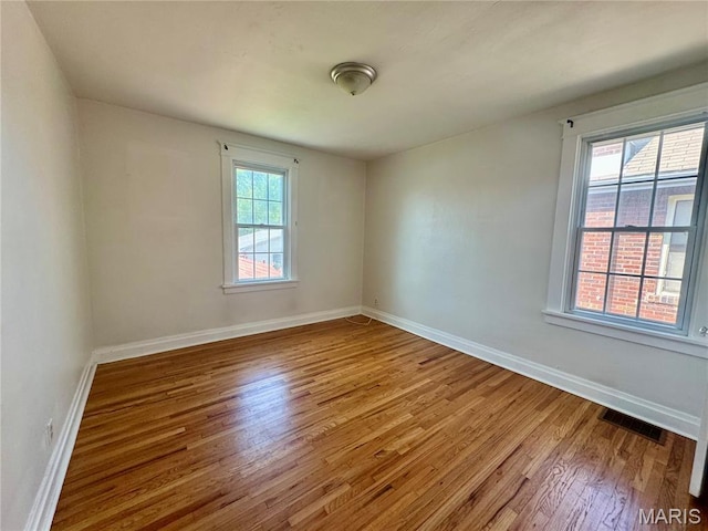6328 Bradley Ave, Saint Louis, MO 63139 - unfurnished room with wood finished floors and baseboards