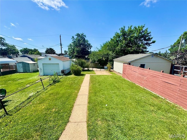 6328 Bradley Ave, Saint Louis, MO 63139 - fenced backyard with a garage and an outdoor structure