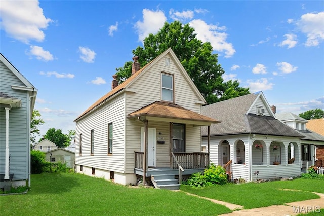 4340 Gannett St, Saint Louis, MO 63116 - view of front facade with covered porch, a chimney, a front yard, and roof with shingles