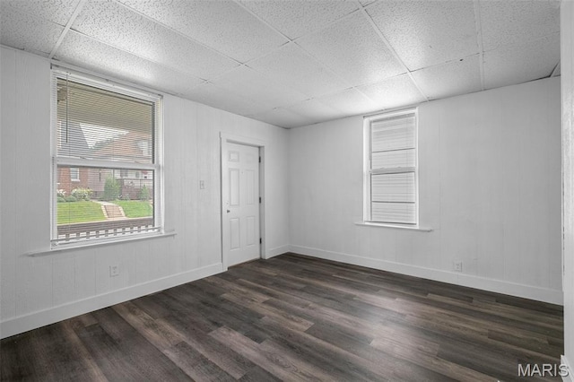 4340 Gannett St, Saint Louis, MO 63116 - empty room featuring a paneled ceiling and dark wood-style flooring