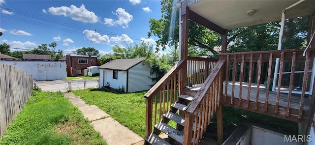 5464 Lindenwood Ave, Saint Louis, MO 63109 - view of green lawn featuring a shed, a deck, and stairway