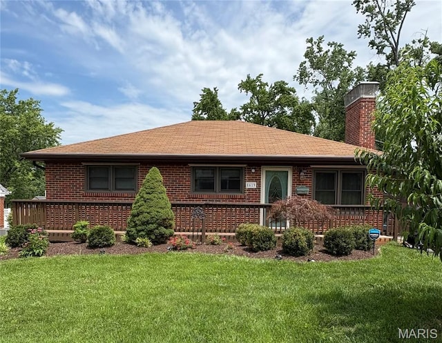 8619 White Ave, Brentwood, MO 63144 - view of front of house featuring brick siding, a chimney, a front lawn, and roof with shingles