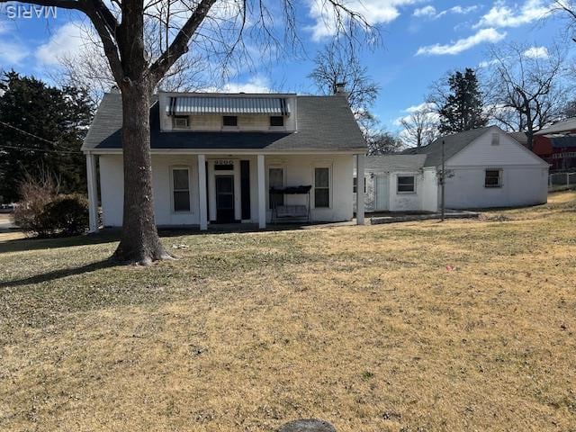 9200 Bellefontaine Rd, Saint Louis, MO 63137 - rear view of house featuring a yard and a porch