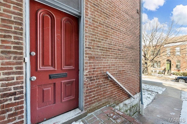2610 Rutger St, Saint Louis, MO 63104 - doorway to property featuring brick siding