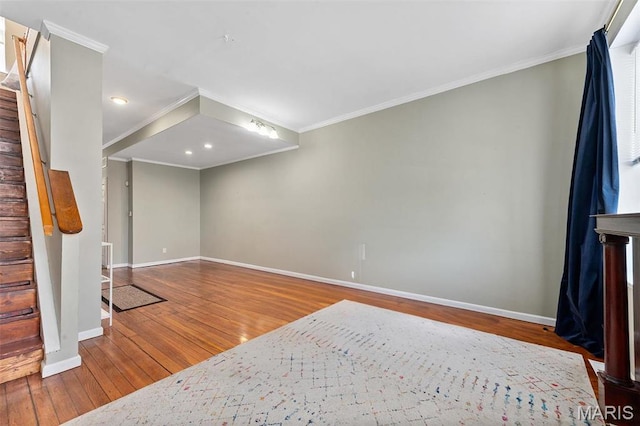 2610 Rutger St, Saint Louis, MO 63104 - unfurnished living room featuring ornamental molding, hardwood / wood-style floors, stairway, and recessed lighting